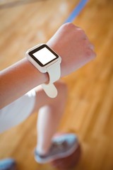 Cropped image of woman wearing smartwatch