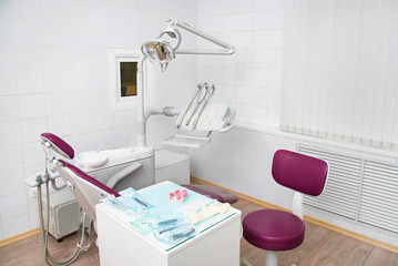 Modern dental office. Dental chair and other accessories used by dentists, orthopedic work place