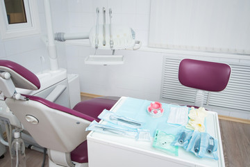 Modern dental office. Dental chair and other accessories used by dentists, orthopedic work place