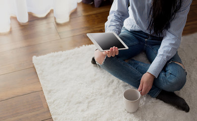 Woman on the floor with tablet