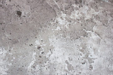 Old gray background texture of wall with cracked paint. Worn colored texture. Abstract banner with copy space.