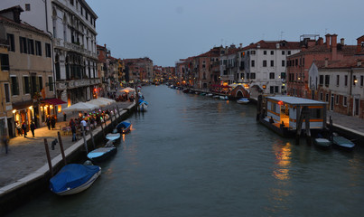  Cannaregio Canal Venice in the early evening with Restaurants, Bars and vaporetto stop. - obrazy, fototapety, plakaty