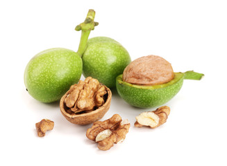 fresh walnuts in peel isolated on white background