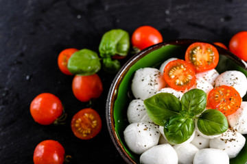 Basil, tomatoes and mozzarella for caprese salad, italian food and healthy vegetarian diet concept