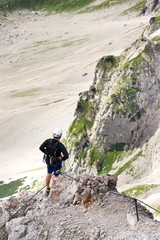 People climbing on via ferrata to Dachstein glacier, Austrian Alps