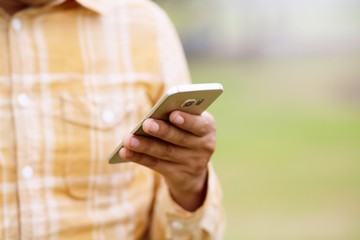 Young Man using mobile smart phone.