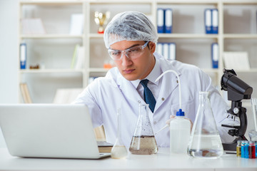 Young researcher scientist doing a water test contamination expe