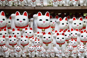 Tons of small dolls "the beckoning cat" known as maneki neko at Gotokuji in Tokyo, JAPAN.
