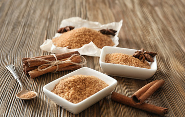 Beautiful composition with cinnamon sugar on wooden background