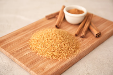 Sweet cinnamon sugar on wooden board
