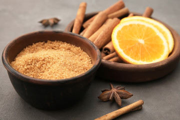Composition with cinnamon sugar and sticks on table