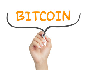 female hand writing bitcoin message inside curly braces with marker on transparent board