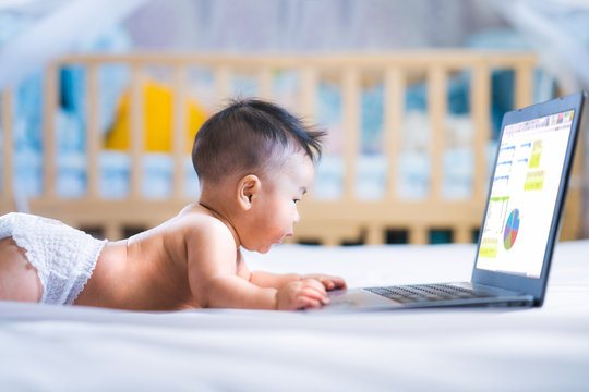 Asian business baby working with computer notebook