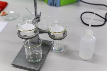 Separating by filtration the component substances from liquid mixture in Lab.