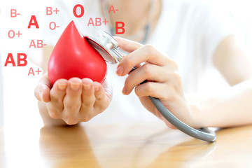 Doctor hands holding a red blood