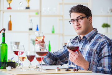 Professional sommelier tasting red wine 
