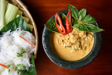 Crab meat in yellow curry soup and white Thai noodle