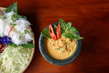 Crab meat in yellow curry soup and white Thai noodle