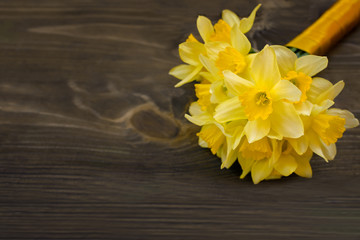 wedding bouquet of yellow daffodils with a satin ribbon. runaway bride. signs at the wedding.	