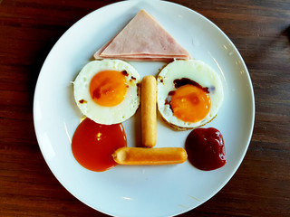 funny breakfast face with ham hotdog egg sausage