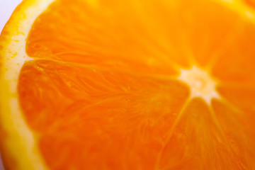 Orange cut half texture close up. Orange structure macro view, backdrop.