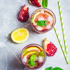 Winter alcohol free pomegranate and mint cocktail. Top view, space for text