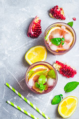 Mint and lemon pomegranate cocktail. Top view, space for text.