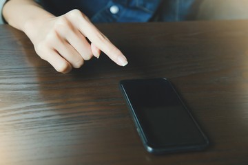 Handsome Business man in an using telephone on wooden table