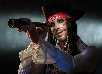 Portrait of a young man in a pirate costume.