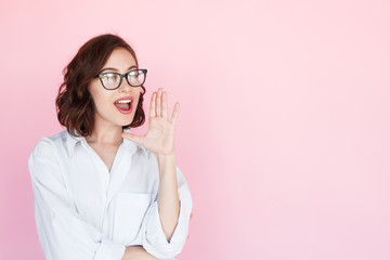 Brunette woman yelling holding hand near mouth