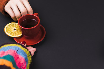 The man gives the girl the tea. Close-up
