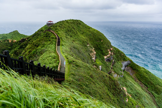 Asain woman enjoy the view of bitou cape in Taiwan