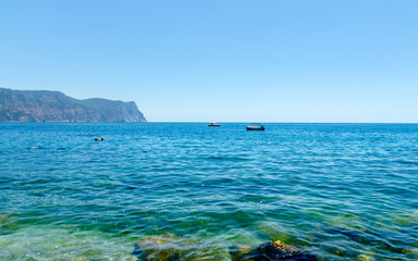 Fototapeta premium Panoramic beautiful azure sea summer landscape of Crimea shore with boat