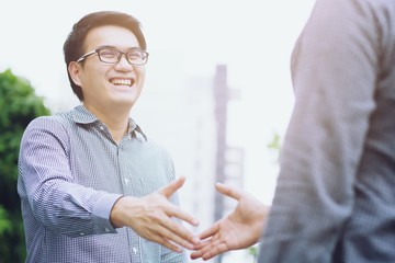 Young Business Shaking hands greetings.