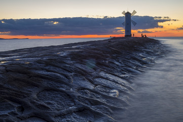 lighthouse on the coast of the Baltic sea at sunset