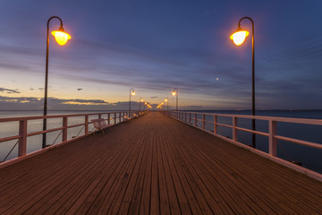 Beautiful sunrise over a wooden pier in Gdynia, Poland