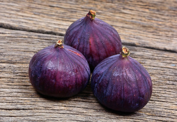 Heap of fig fruits on wooden table