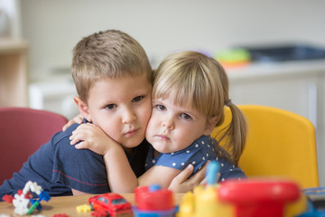 Fototapeta premium Hugged little caucasian kids