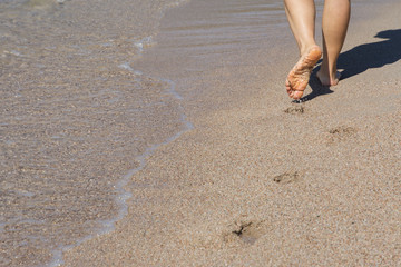 view of the feet on a sea beach