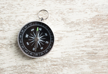 Compass on a wood with space for text