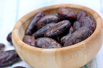 Cocoa beans in a bamboo bowl
