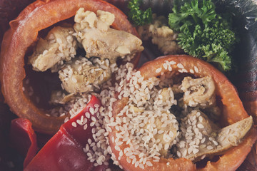 Healthy food, bell pepper stuffed with chicken, broccoli, sesame