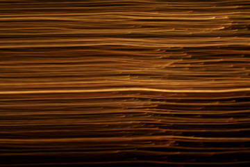 abstract background of the blurred lines of light on black