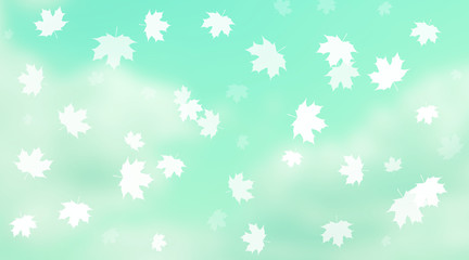 Maple leaves falling in front of cloudy sky