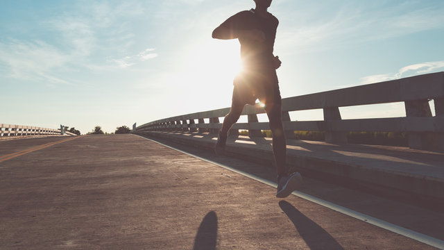 The Man With Runner On The Street Be Running For Exercise.