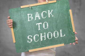 Back to school written on chalkboard