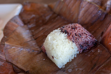 Sticky rice cooked in an ancient way wrapped with banana leaves.