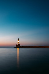 Fototapeta na wymiar Sunset view of the lighthouse / old port of Chania in Crete, Greece