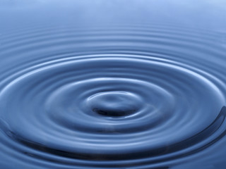 droplet hits on the water tension surface making wave