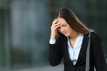 Executive suffering headache on the street